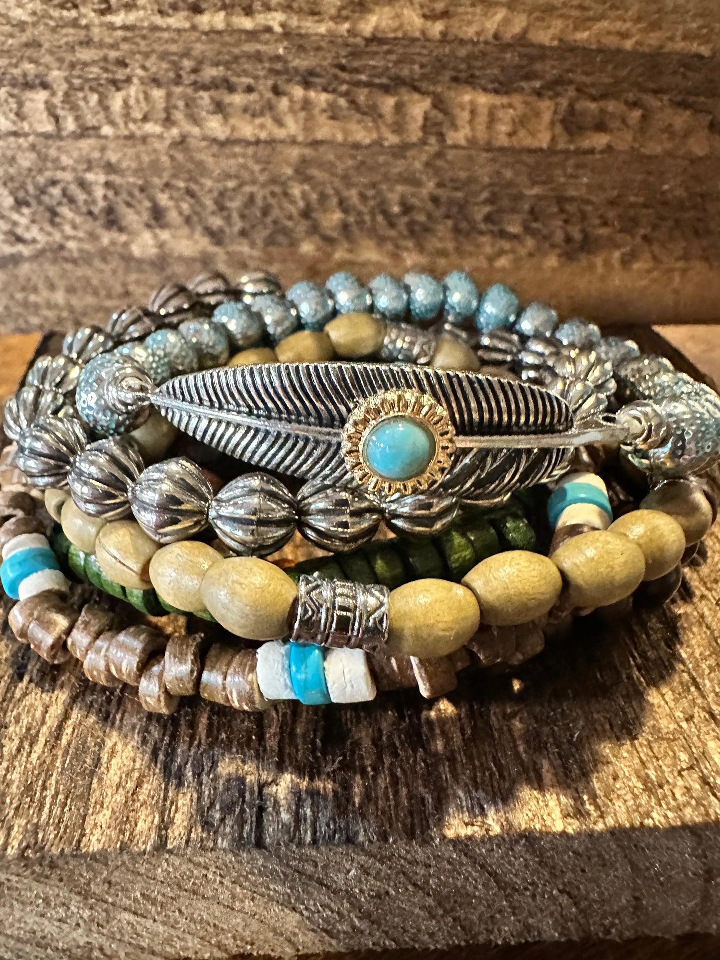 Shop Bohemian Hippie Bracelet Set: 4-piece chic wooden beads & love feather stretch bracelets in a gift box. Stylish, meaningful, and perfect for layering. Buy now! - Silver Elegant