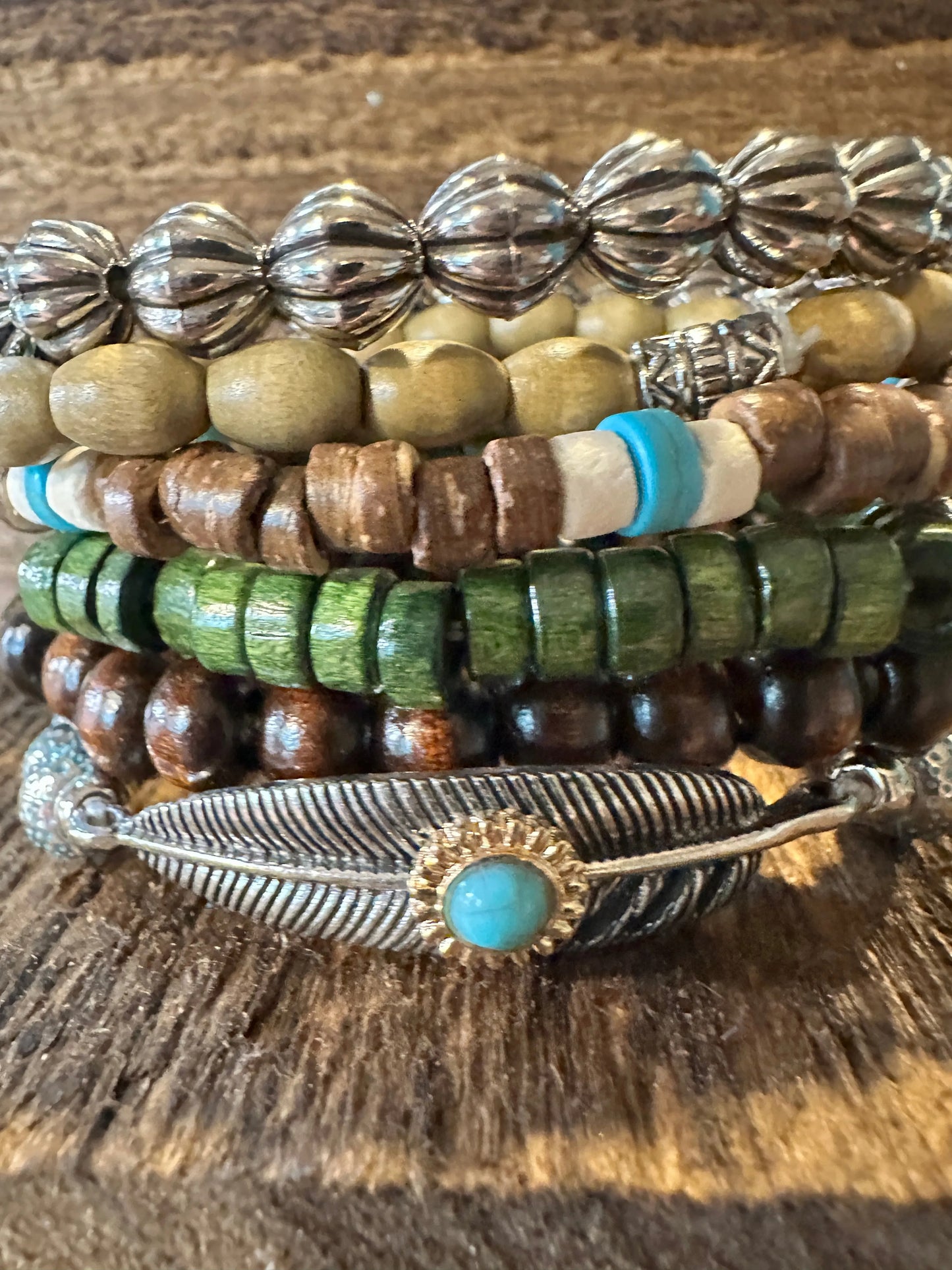 Shop Bohemian Hippie Bracelet Set: 4-piece chic wooden beads & love feather stretch bracelets in a gift box. Stylish, meaningful, and perfect for layering. Buy now! - Silver Elegant