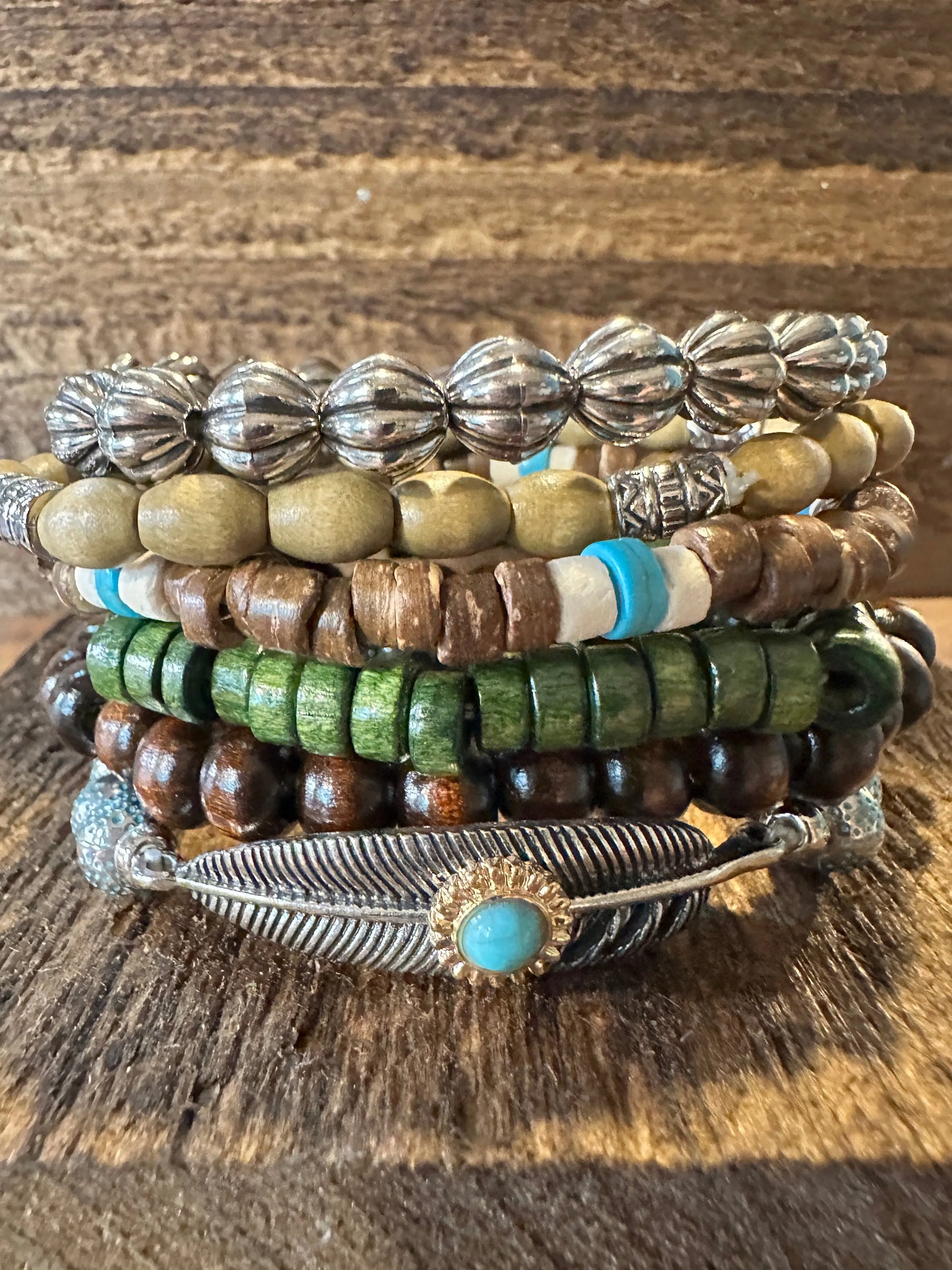 Shop Bohemian Hippie Bracelet Set: 4-piece chic wooden beads & love feather stretch bracelets in a gift box. Stylish, meaningful, and perfect for layering. Buy now! - Silver Elegant