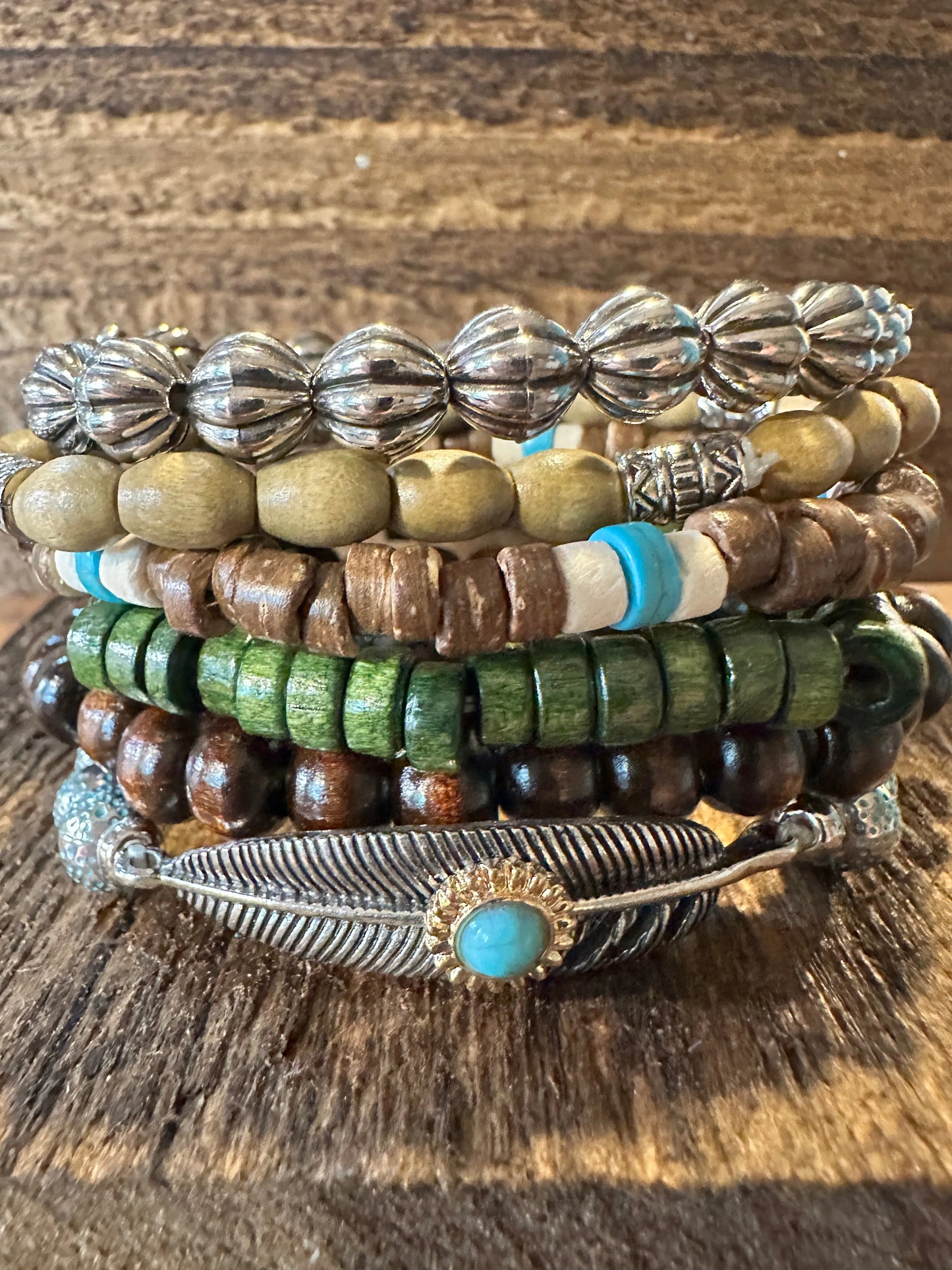 Shop Bohemian Hippie Bracelet Set: 4-piece chic wooden beads & love feather stretch bracelets in a gift box. Stylish, meaningful, and perfect for layering. Buy now! - Silver Elegant