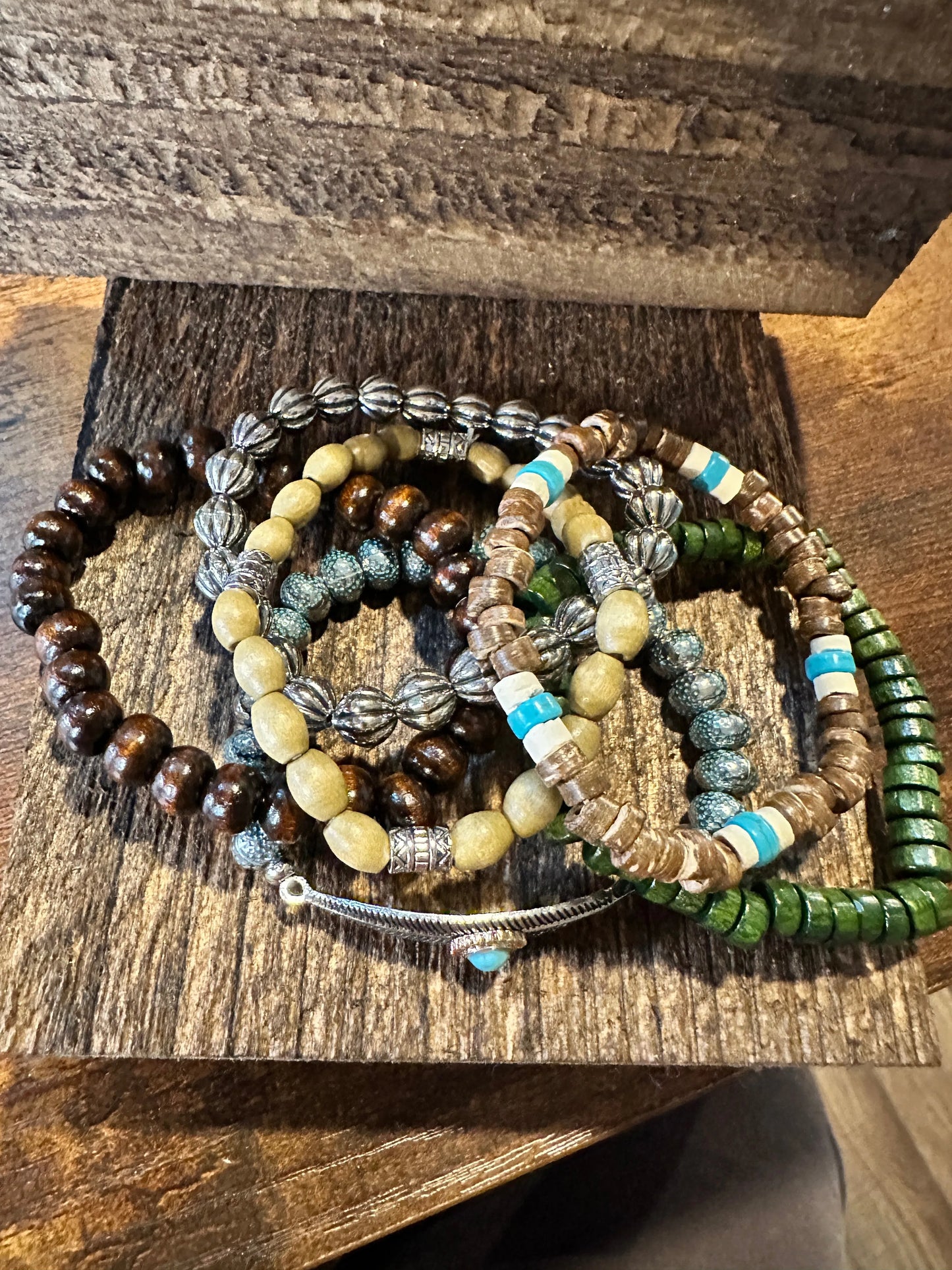 Shop Bohemian Hippie Bracelet Set: 4-piece chic wooden beads & love feather stretch bracelets in a gift box. Stylish, meaningful, and perfect for layering. Buy now! - Silver Elegant
