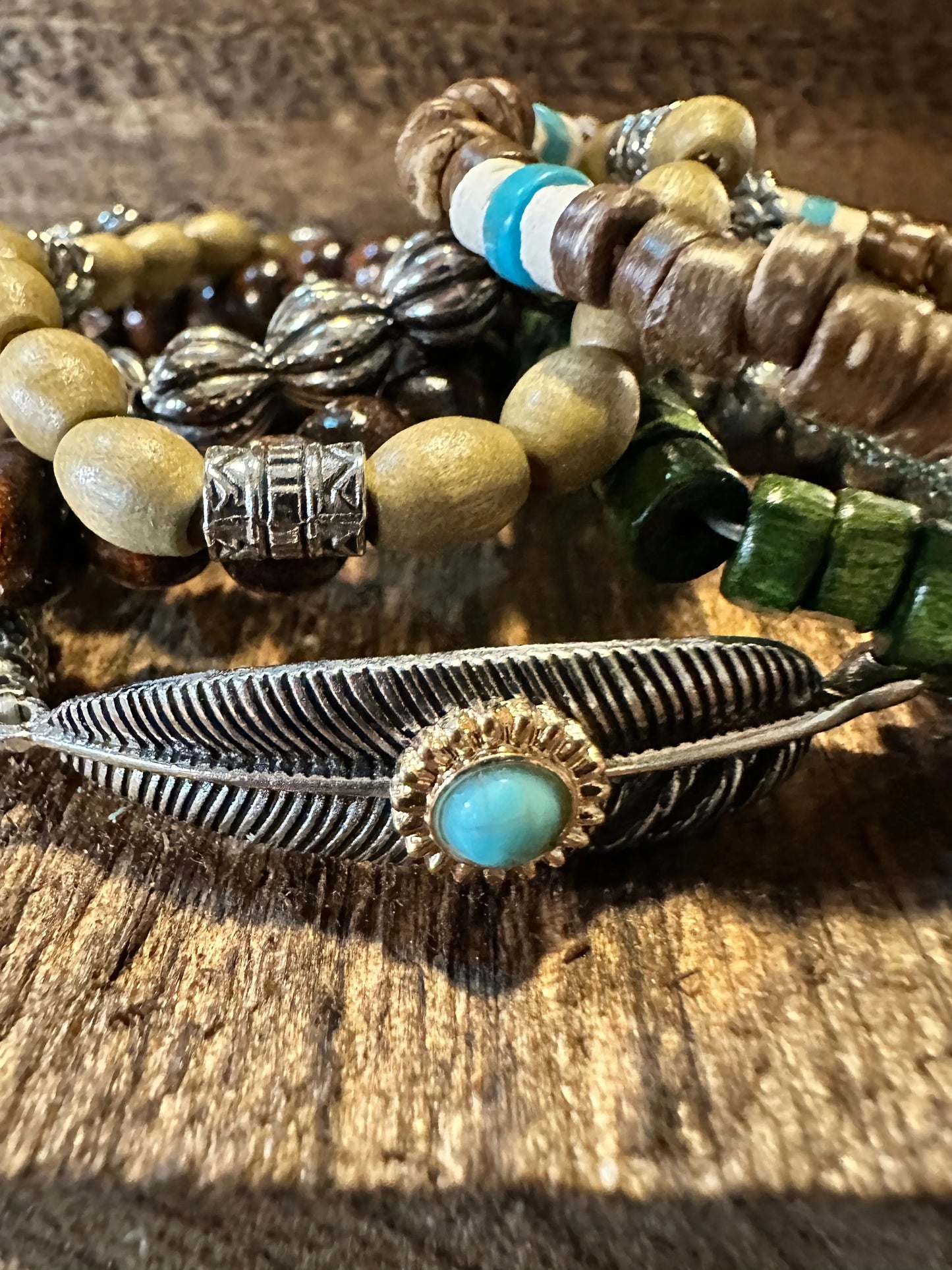 Shop Bohemian Hippie Bracelet Set: 4-piece chic wooden beads & love feather stretch bracelets in a gift box. Stylish, meaningful, and perfect for layering. Buy now! - Silver Elegant