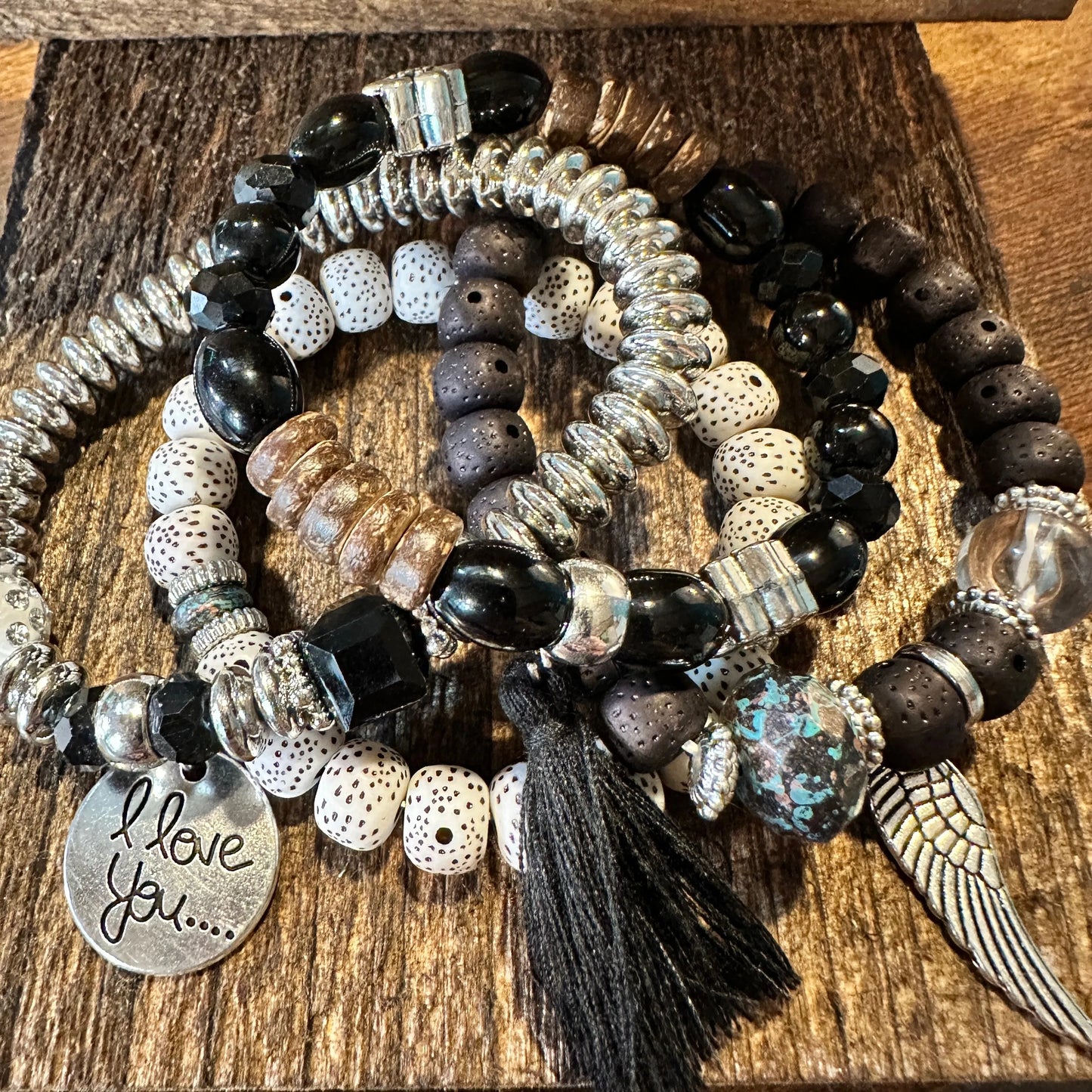 Bohemian Hippie Bracelet Set featuring chic brown wooden beads, love feather charms, and a stretch cord design. 4-piece set in a gift box. - Silver Elegant