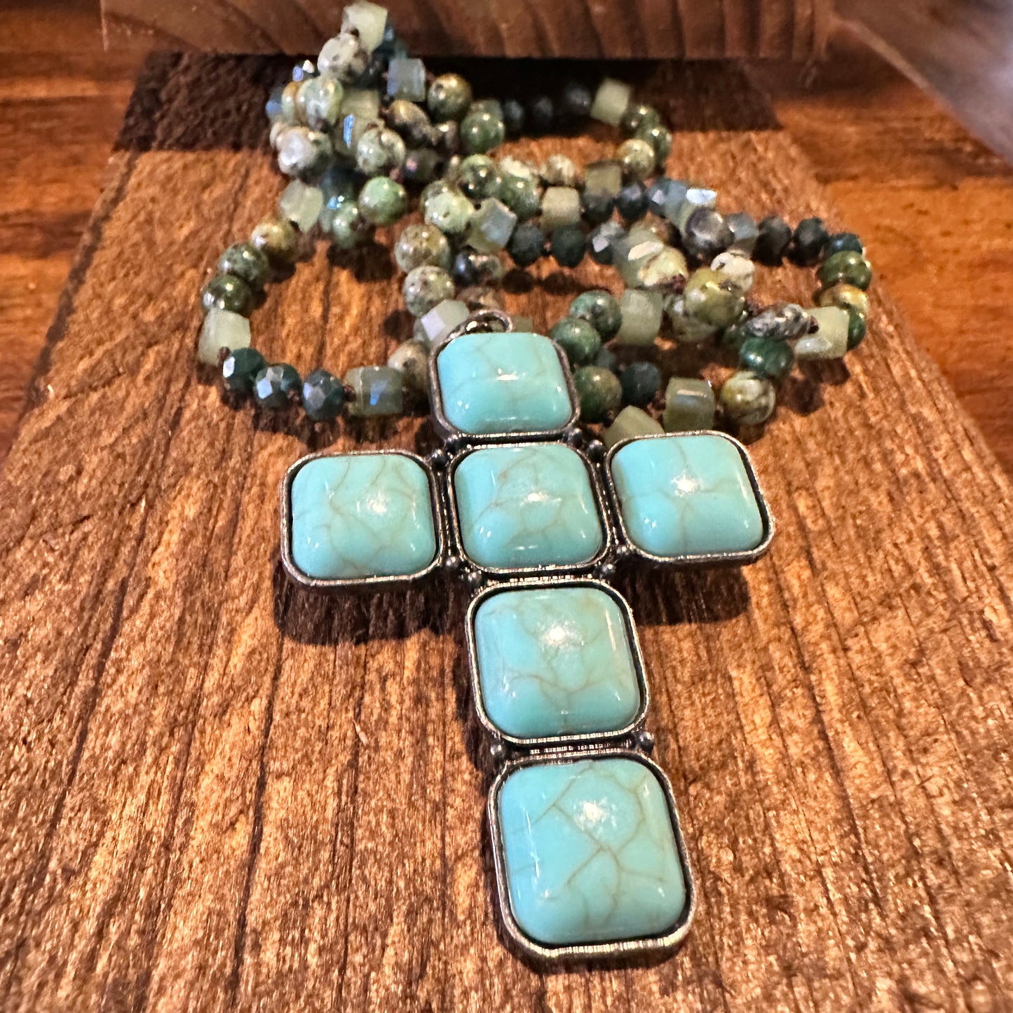 :
Bohemian Turquoise Stone Glass Necklace featuring a sterling silver square cross pendant, handcrafted with turquoise beads, and packaged in a gift box - Silver Elegant