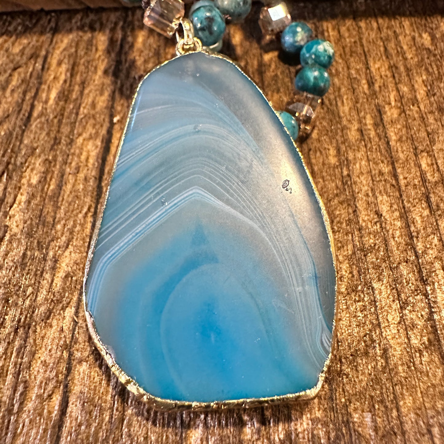 Shop Bohemian Natural Stone Glass Knot Pendant Necklace: Teal drop pendant with a love knot design. Comes in a gift box. Elegant, timeless, and meaningful. Buy now! - Silver Elegant
