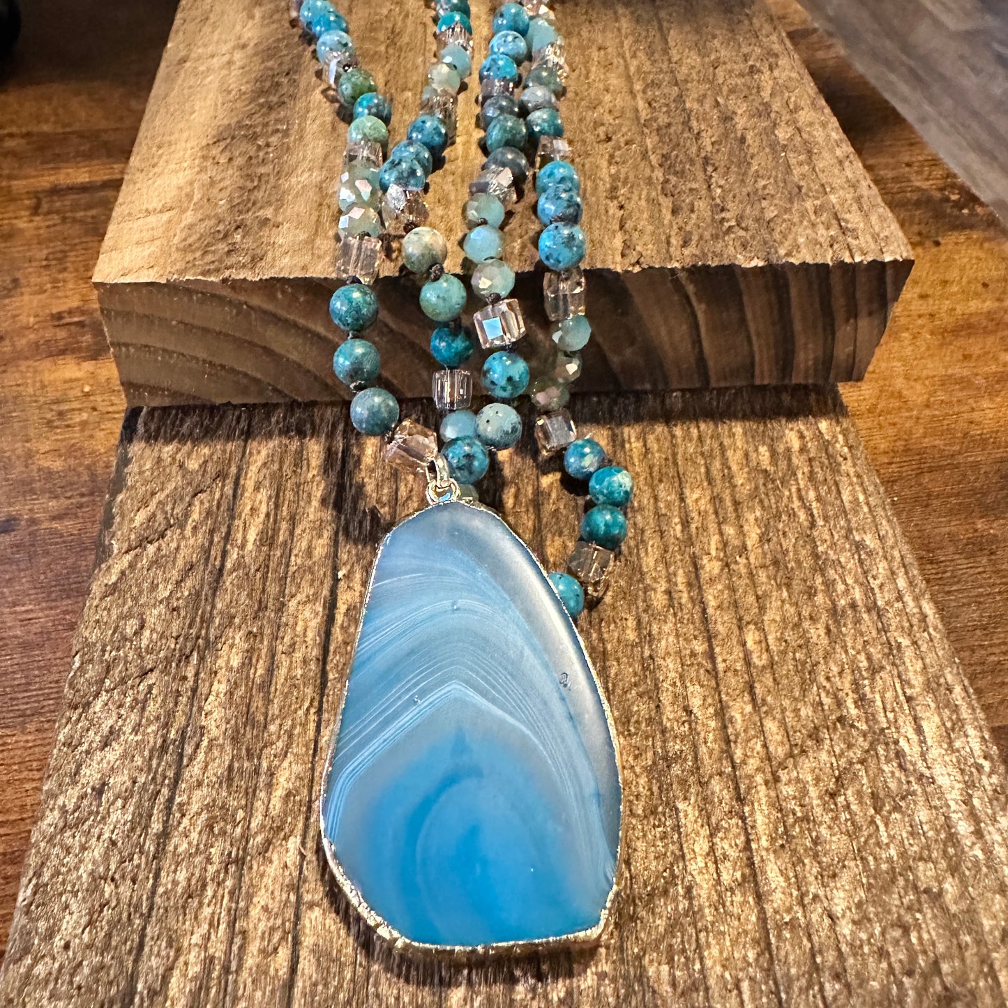 Shop Bohemian Natural Stone Glass Knot Pendant Necklace: Teal drop pendant with a love knot design. Comes in a gift box. Elegant, timeless, and meaningful. Buy now! - Silver Elegant