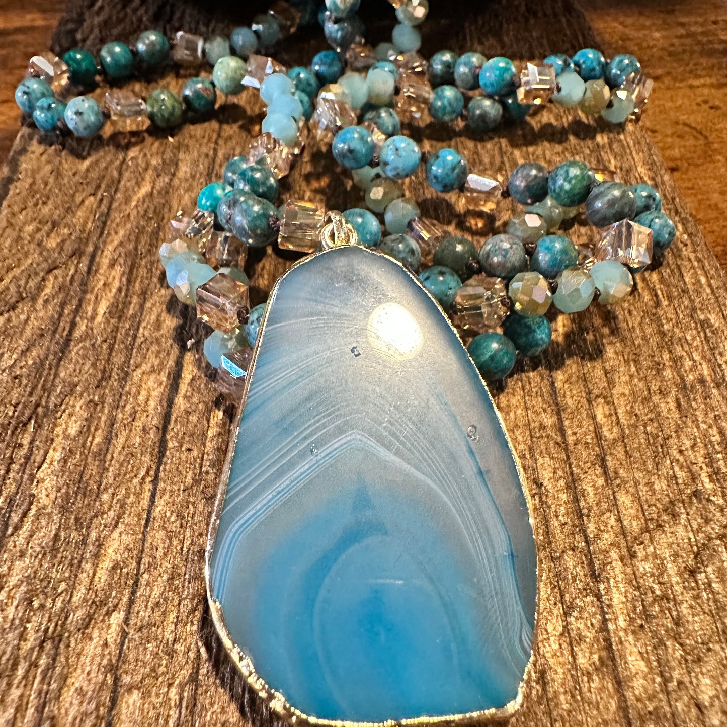Shop Bohemian Natural Stone Glass Knot Pendant Necklace: Teal drop pendant with a love knot design. Comes in a gift box. Elegant, timeless, and meaningful. Buy now! - Silver Elegant