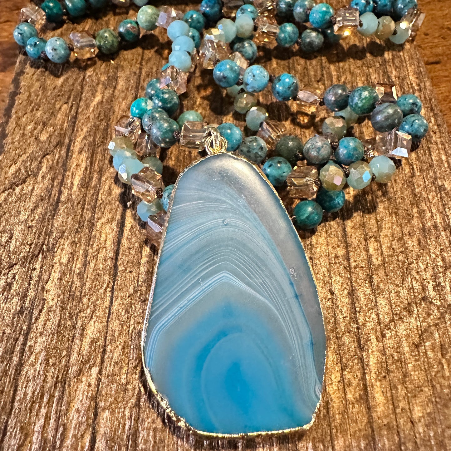 Shop Bohemian Natural Stone Glass Knot Pendant Necklace: Teal drop pendant with a love knot design. Comes in a gift box. Elegant, timeless, and meaningful. Buy now! - Silver Elegant