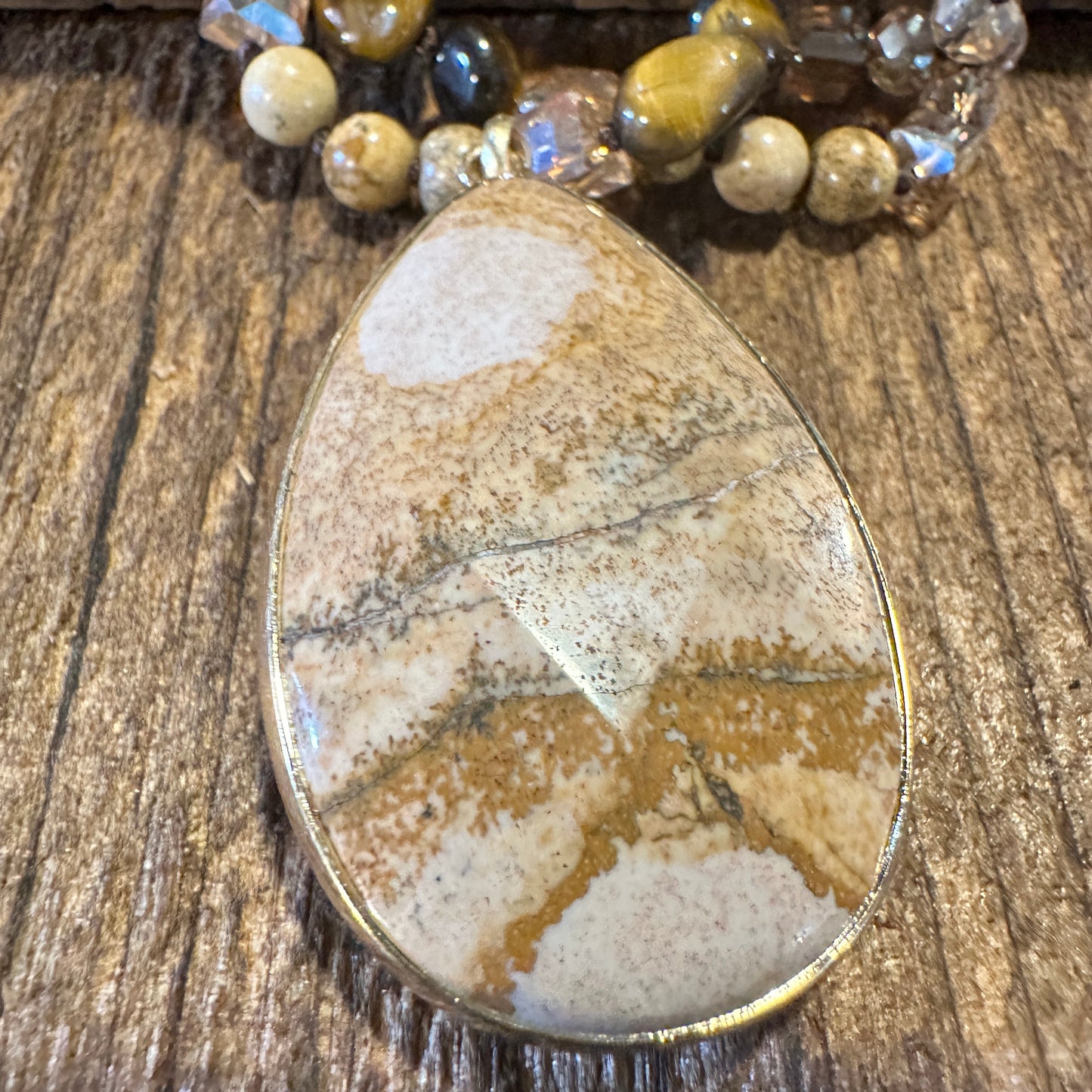 Bohemian Natural Stone Glass Knot Pendant Necklace featuring a brown natural stone pendant with a delicate glass knot design. Ships in an elegant gift box. - Silver Elegant
