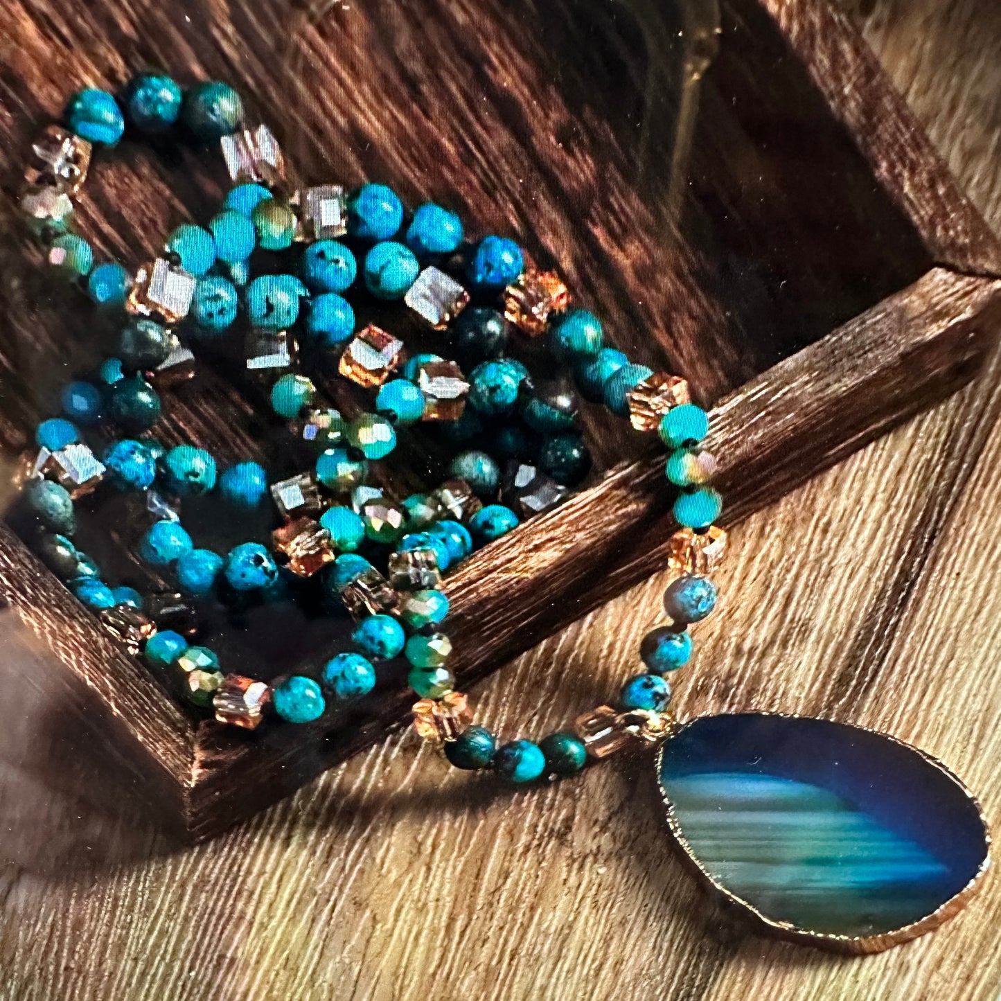 Shop Bohemian Natural Stone Glass Knot Pendant Necklace: Teal drop pendant with a love knot design. Comes in a gift box. Elegant, timeless, and meaningful. Buy now! - Silver Elegant