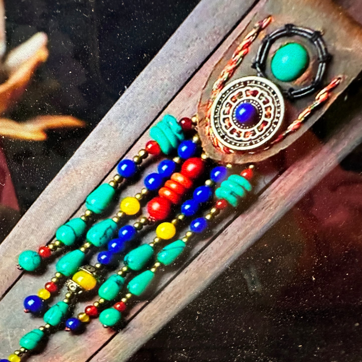 Artisan Boho Beaded Necklace featuring a vintage gemstone centerpiece, leather fringe, and green gemstone accents with gold details, gift boxed.- Silver Elegant