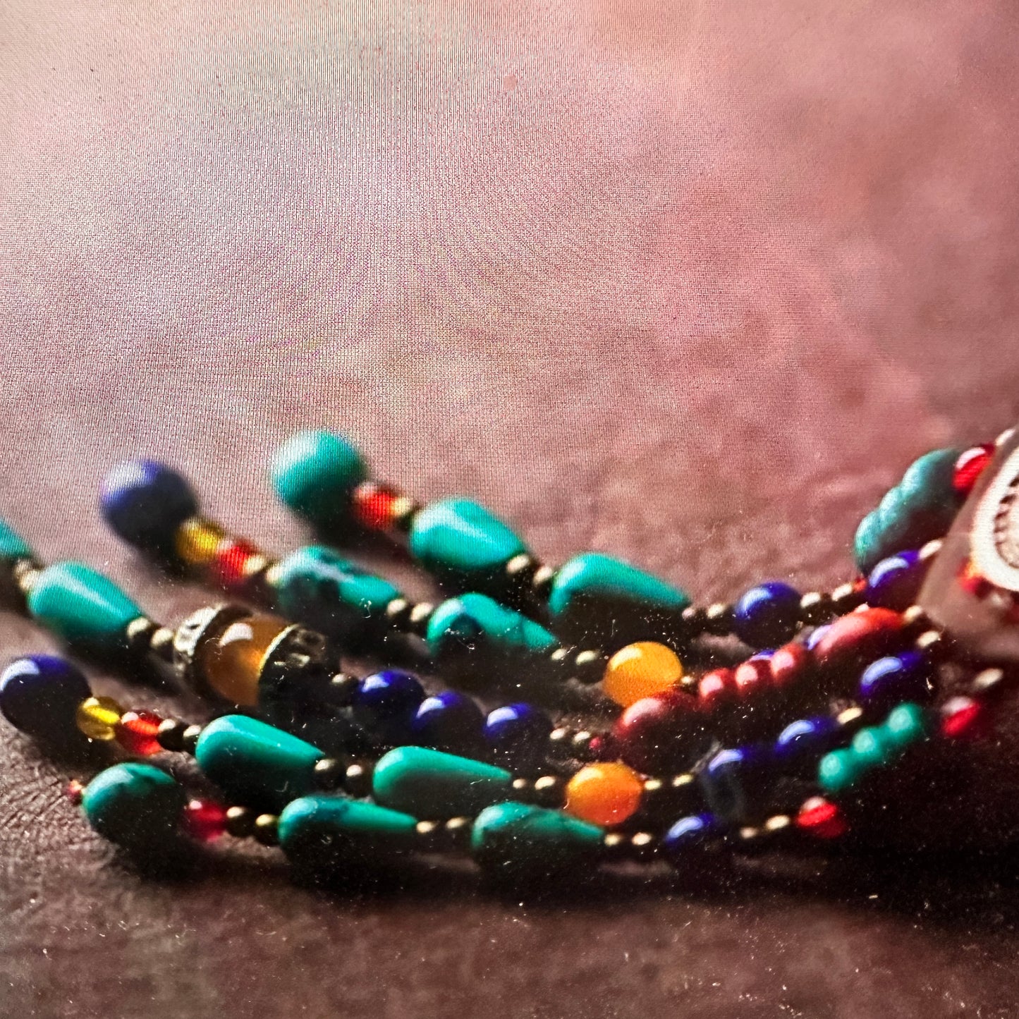 Artisan Boho Beaded Necklace featuring a vintage gemstone centerpiece, leather fringe, and green gemstone accents with gold details, gift boxed.- Silver Elegant