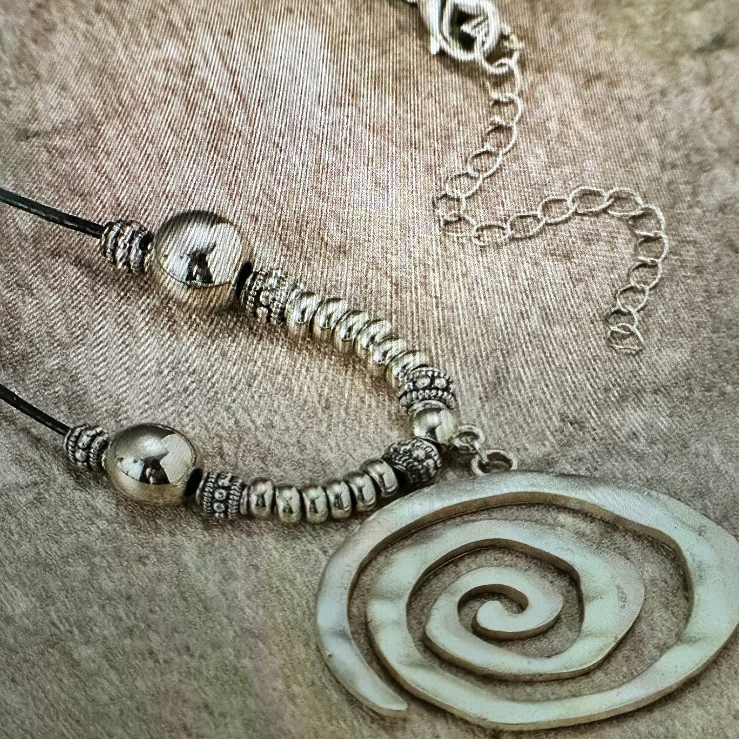Shop Bohemian Silver Circle Pendant Necklace with Leather Cord. Handmade, elegant, adjustable, and perfect as a gift for her. Comes in a stylish gift box. Buy now! - Silver Elegant