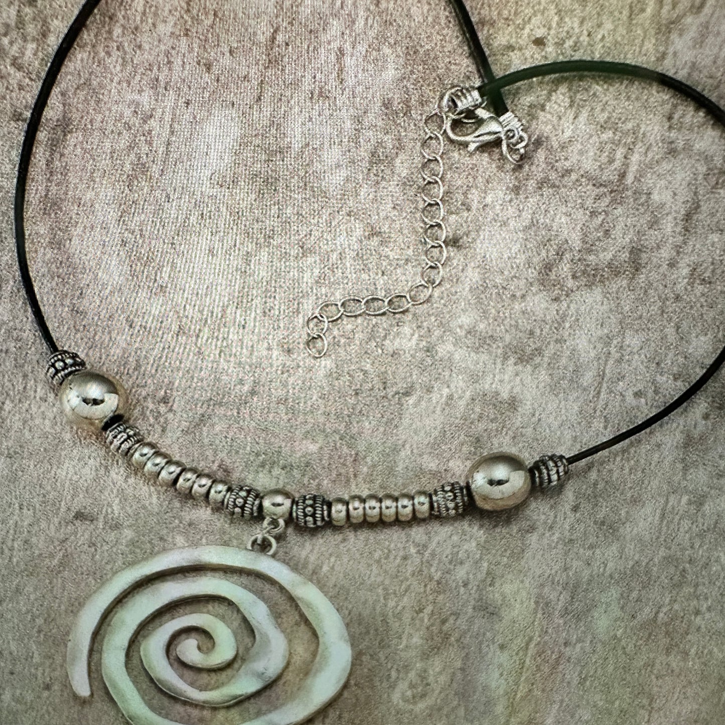Shop Bohemian Silver Circle Pendant Necklace with Leather Cord. Handmade, elegant, adjustable, and perfect as a gift for her. Comes in a stylish gift box. Buy now! - Silver Elegant