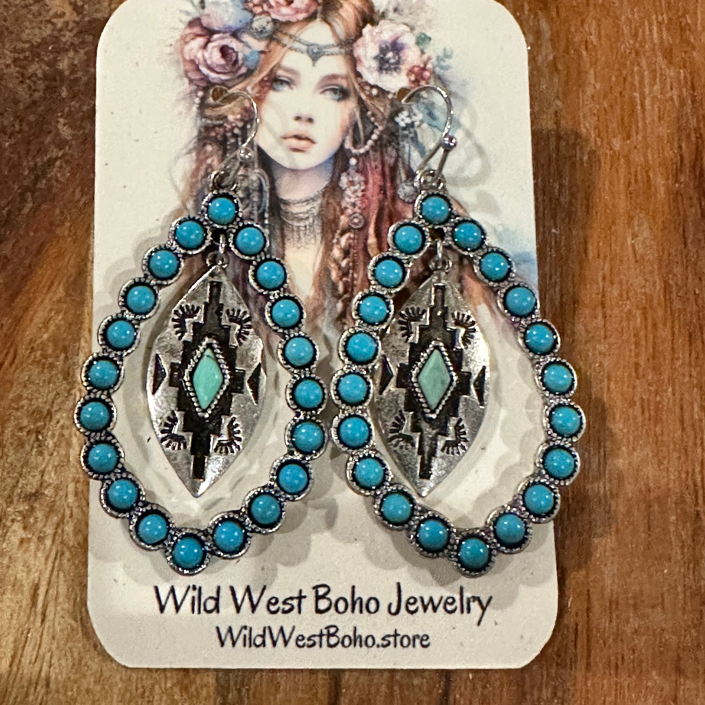 Aztec-inspired Teardrop Turquoise Earrings featuring a vibrant turquoise coating and intricate patterns, perfect for a bold, chic statement.