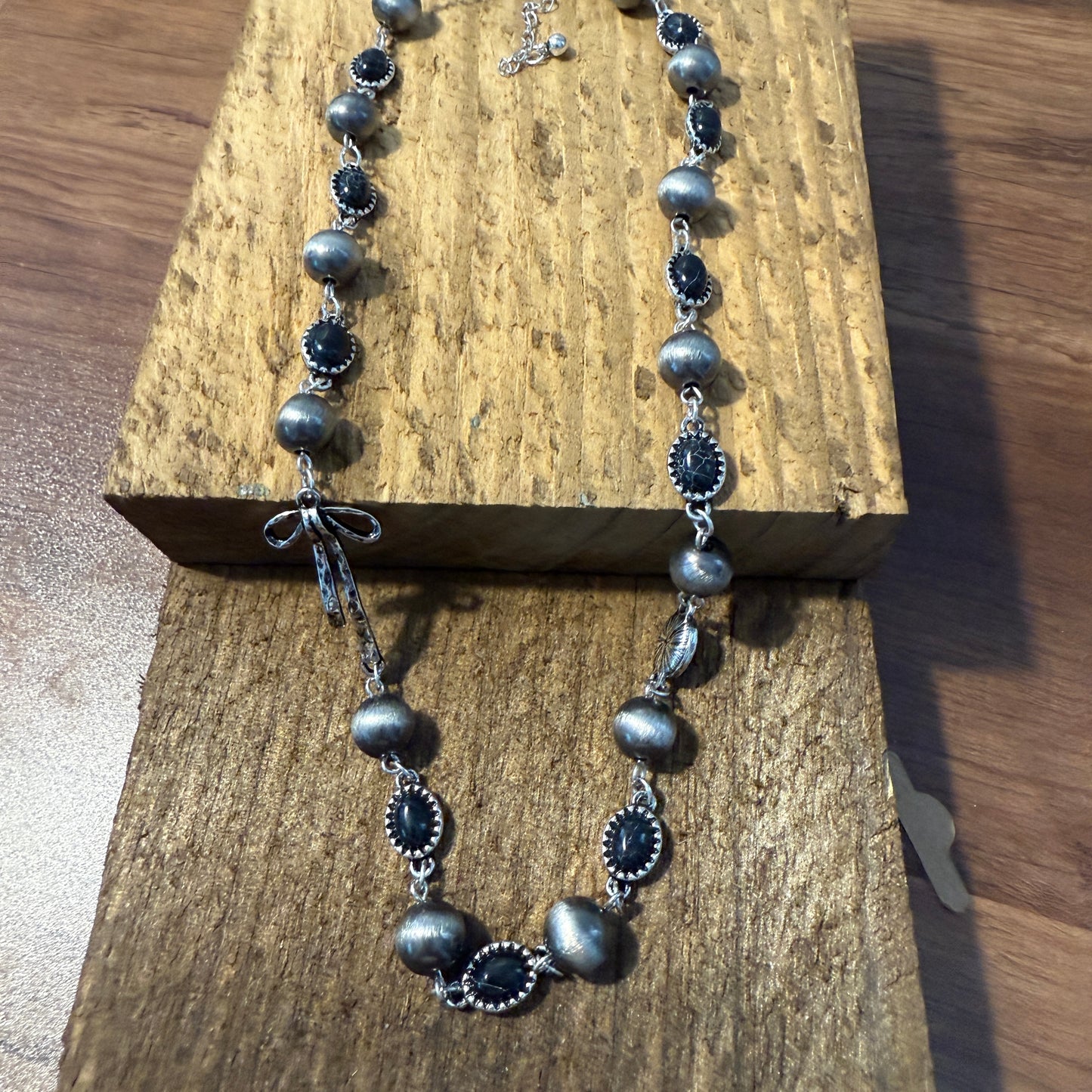 Western Style Navajo Pearl Stone Coquette Bow Necklace in Black and Brushed Silver