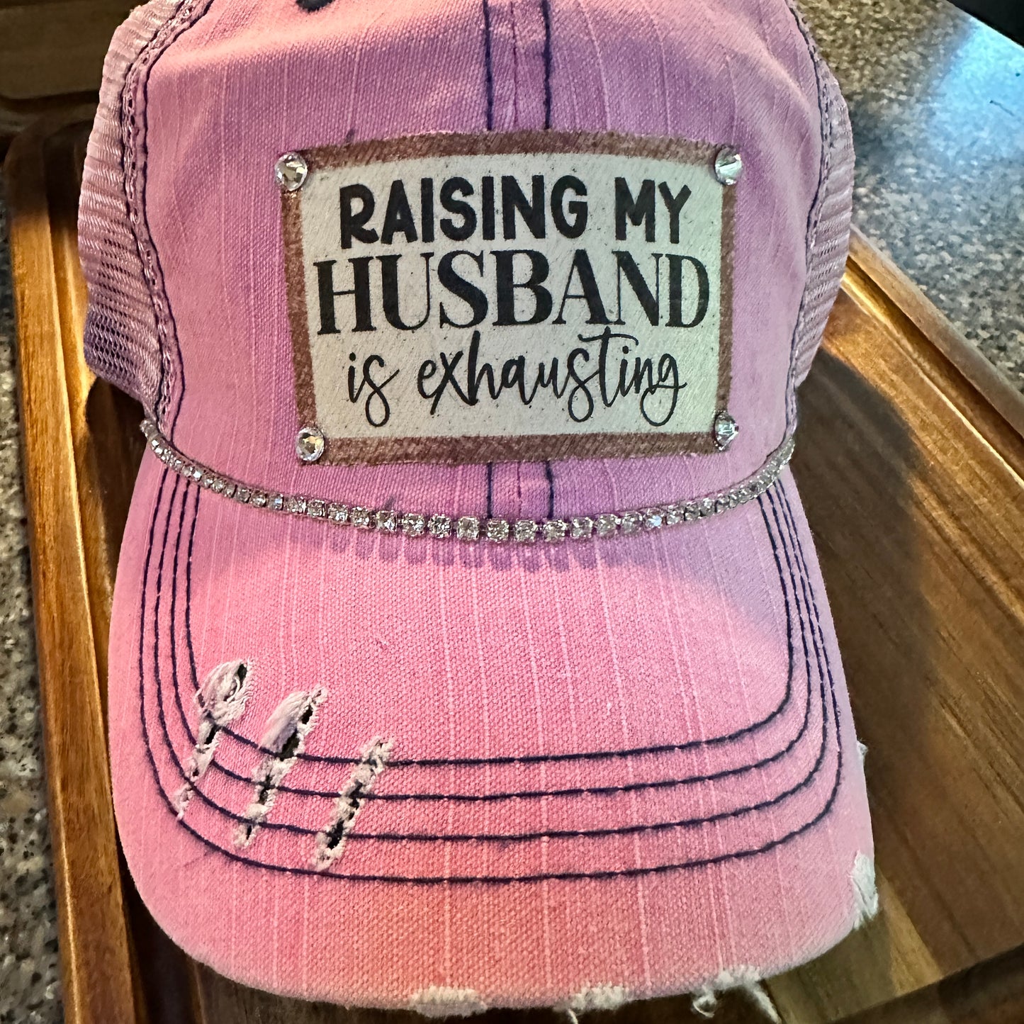 "Husband Taming is Tireless" Distressed Trucker Hat (#161): Bling / Pink / Jana's Flannels