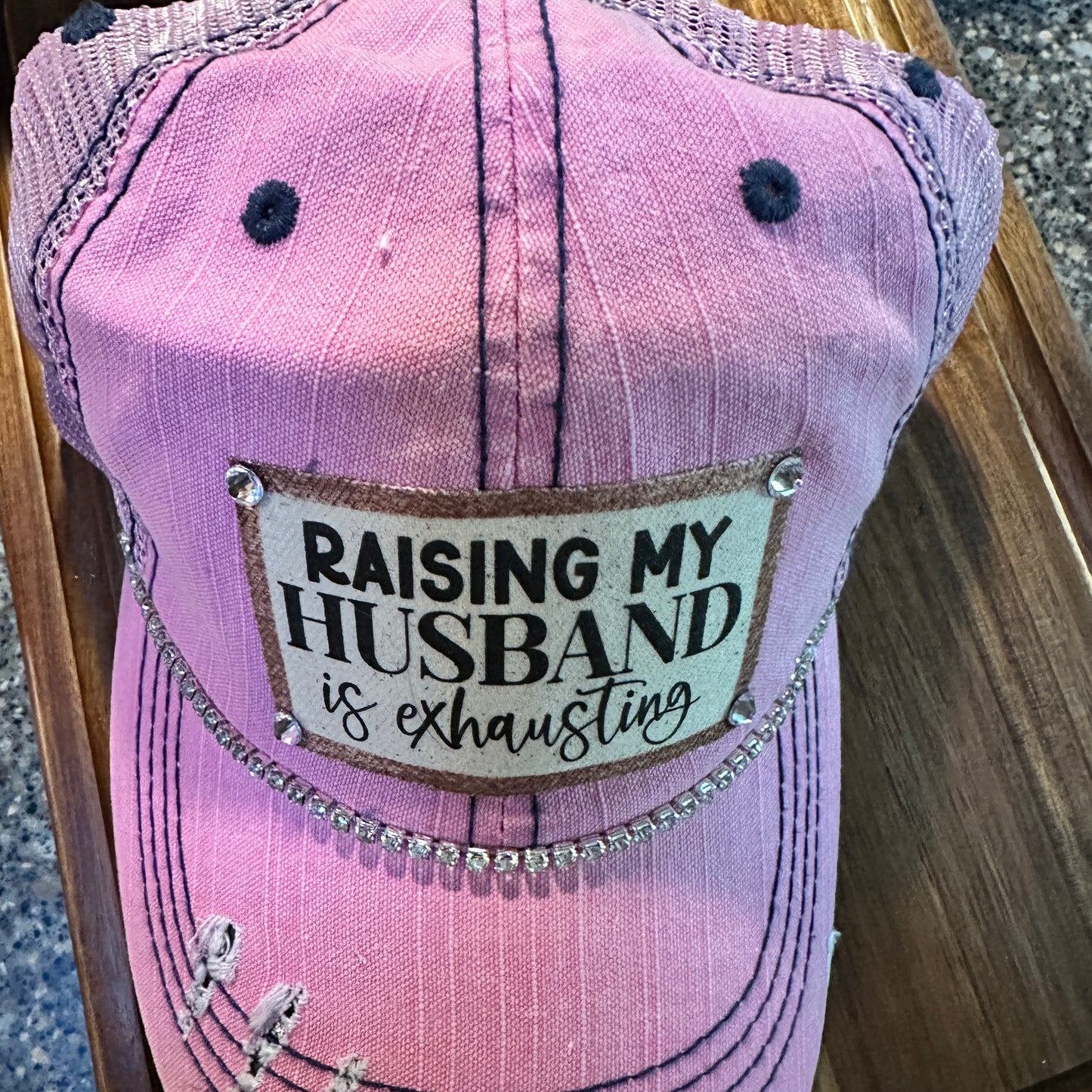 "Husband Taming is Tireless" Distressed Trucker Hat (#161): Bling / Pink / Jana's Flannels