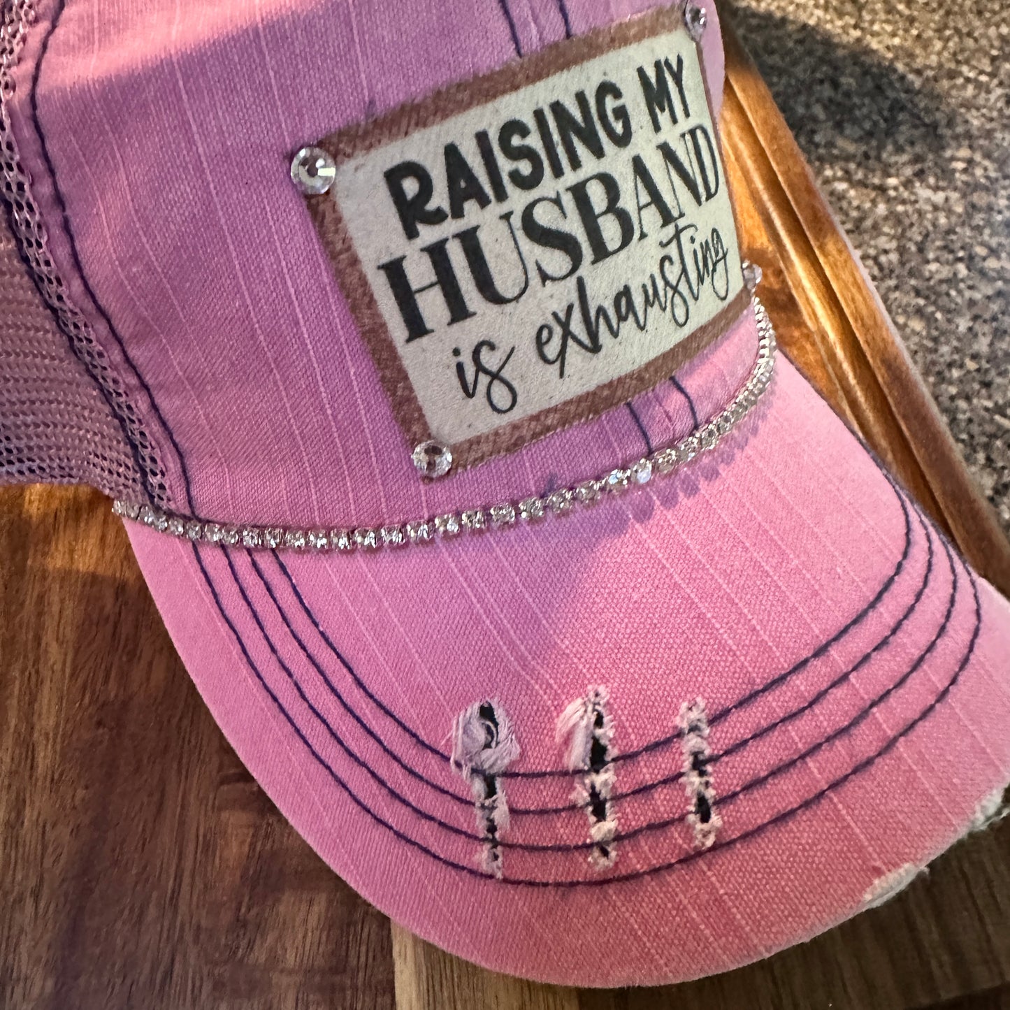 "Husband Taming is Tireless" Distressed Trucker Hat (#161): Bling / Pink / Jana's Flannels