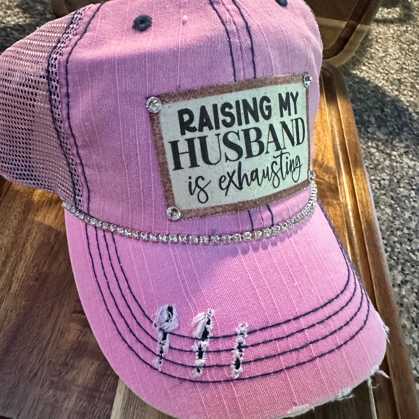 "Husband Taming is Tireless" Distressed Trucker Hat (#161): Bling / Pink / Jana's Flannels