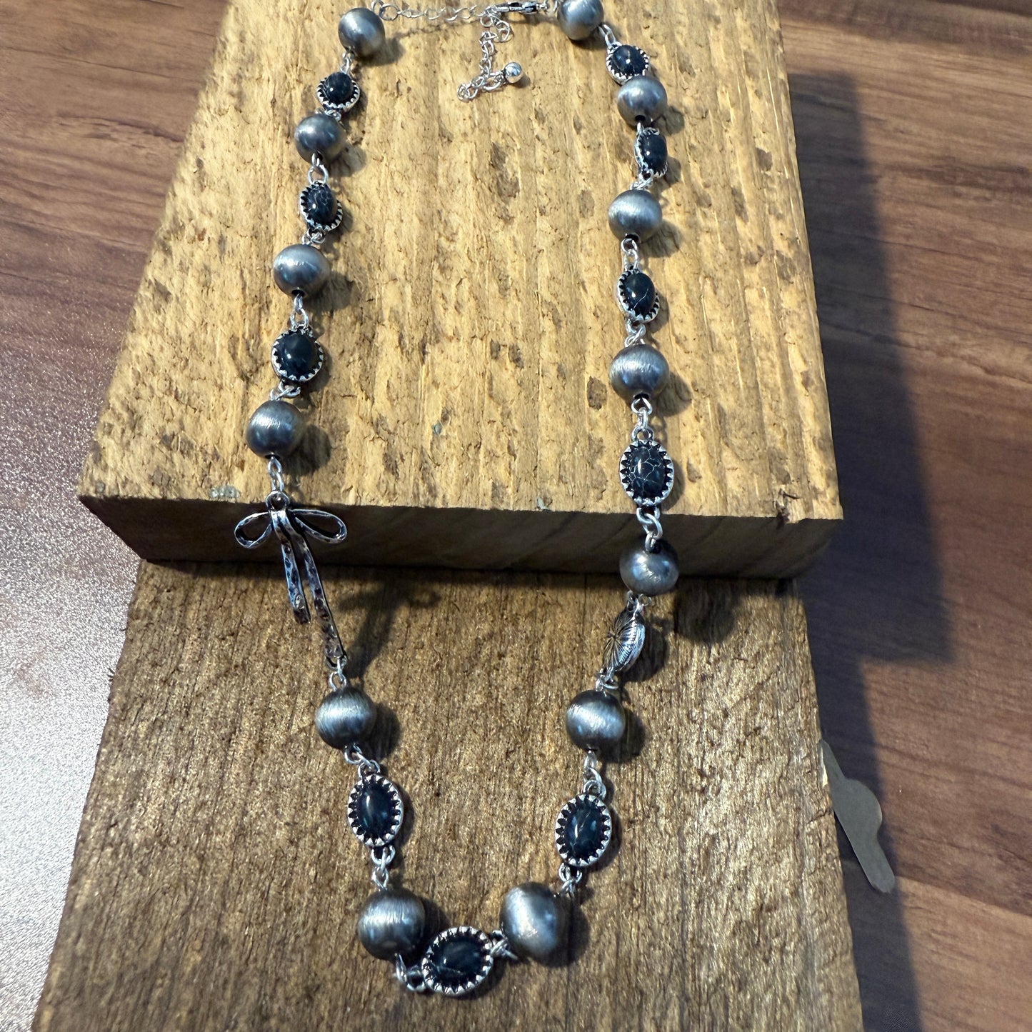 Western Style Navajo Pearl Stone Coquette Bow Necklace in Black and Brushed Silver