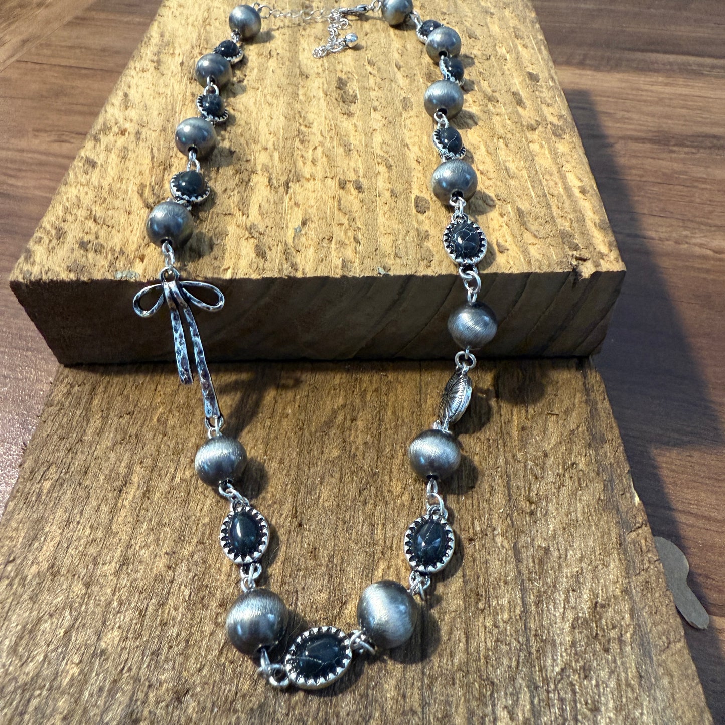 Western Style Navajo Pearl Stone Coquette Bow Necklace in Black and Brushed Silver