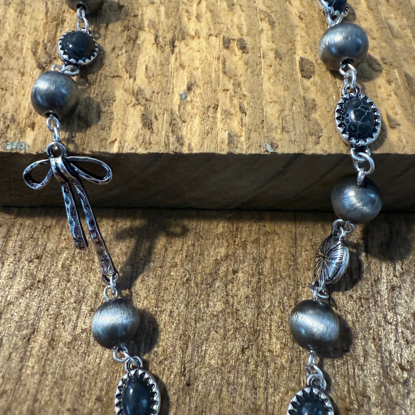 Western Style Navajo Pearl Stone Coquette Bow Necklace in Black and Brushed Silver