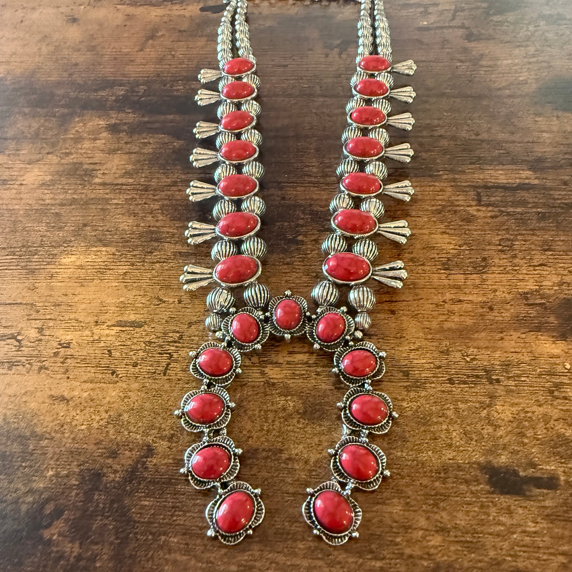 Two-strand red stone squash-blossom Western necklace with silver detailing and faux pearl beads.