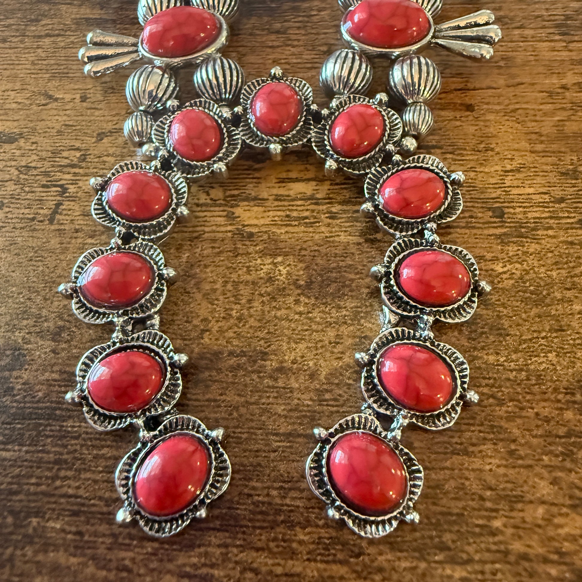 Red stone squash blossom Western necklace with silver-tone detailing and faux pearl beads.