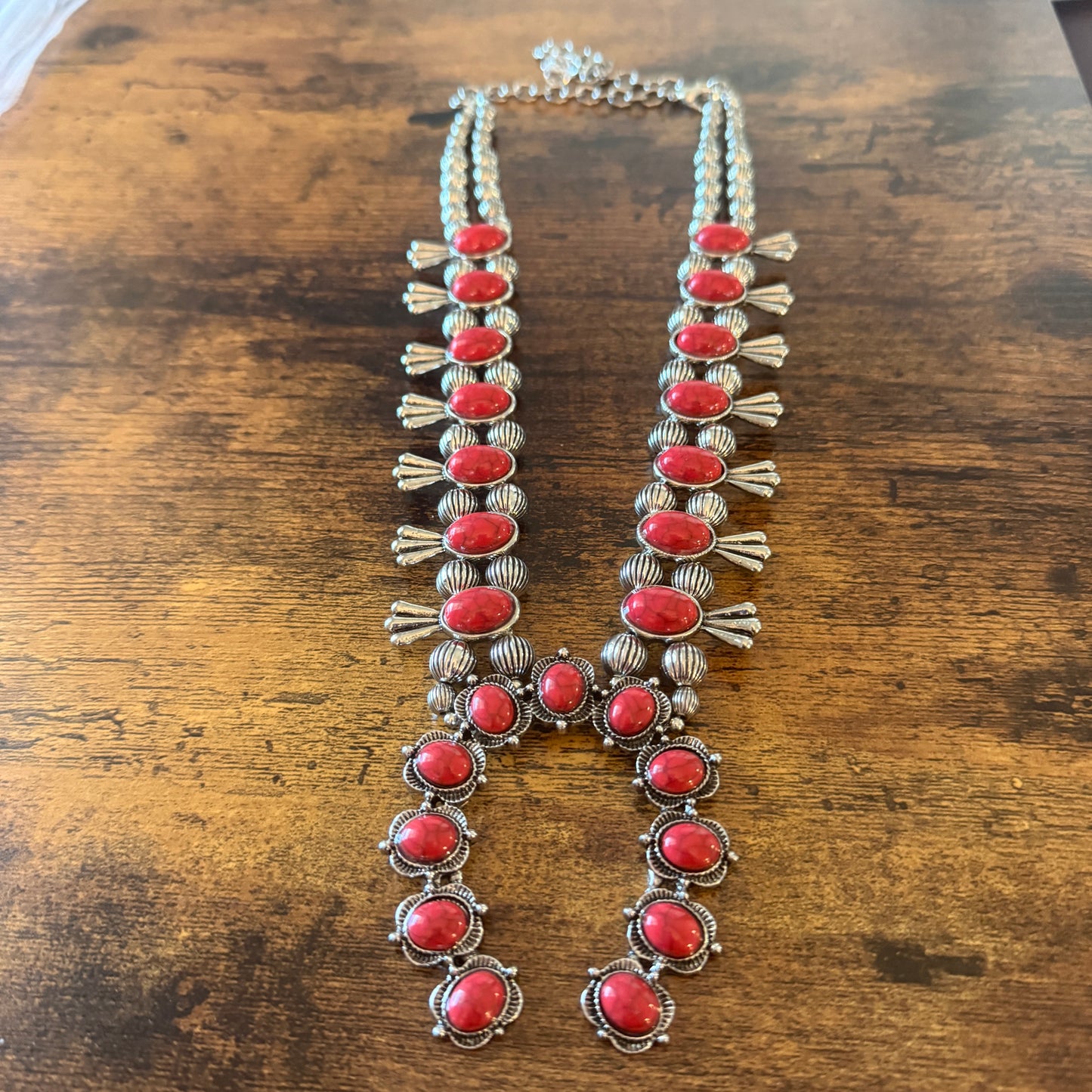 Red stone squash-blossom western necklace with intricate silver detailing and faux silver pearl beads