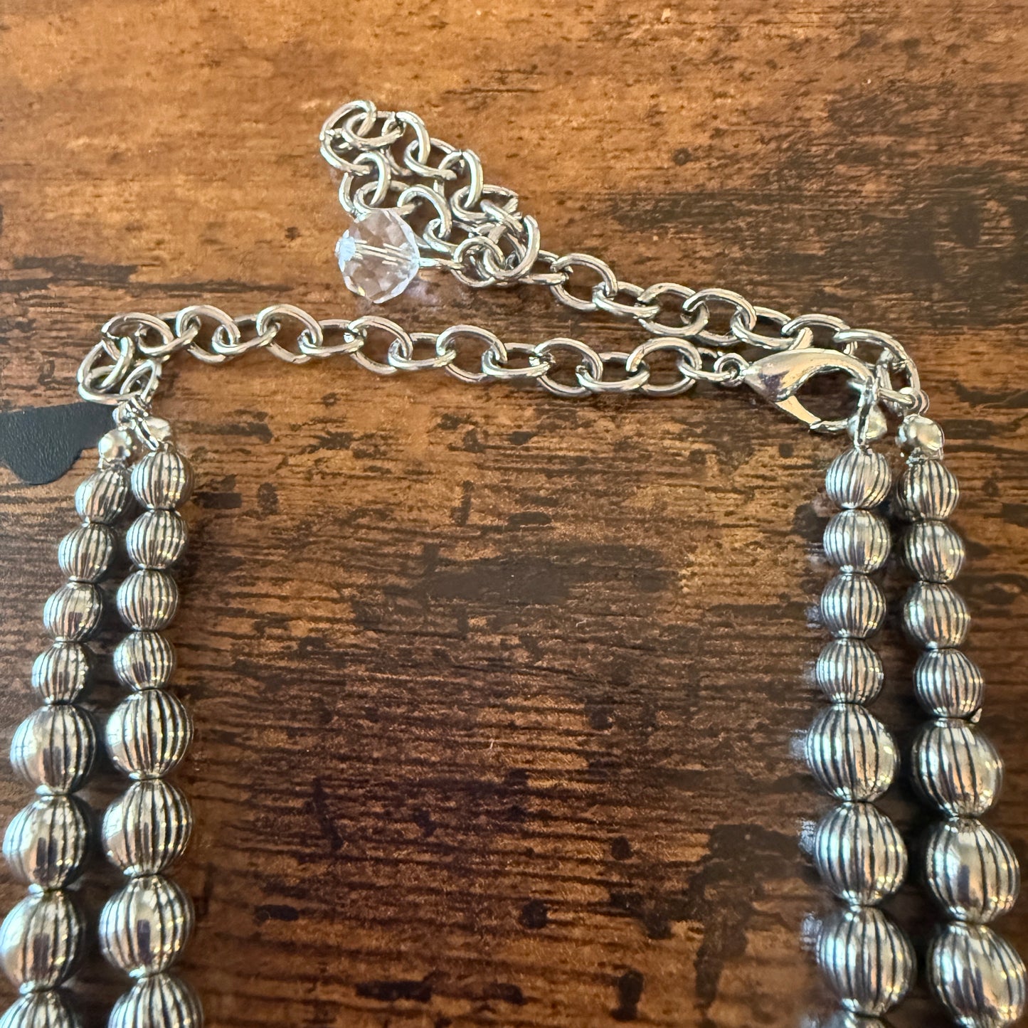 Red Stone Squash Blossom Western Necklace with faux silver pearl beads and multi-strand ribbed silver beads.