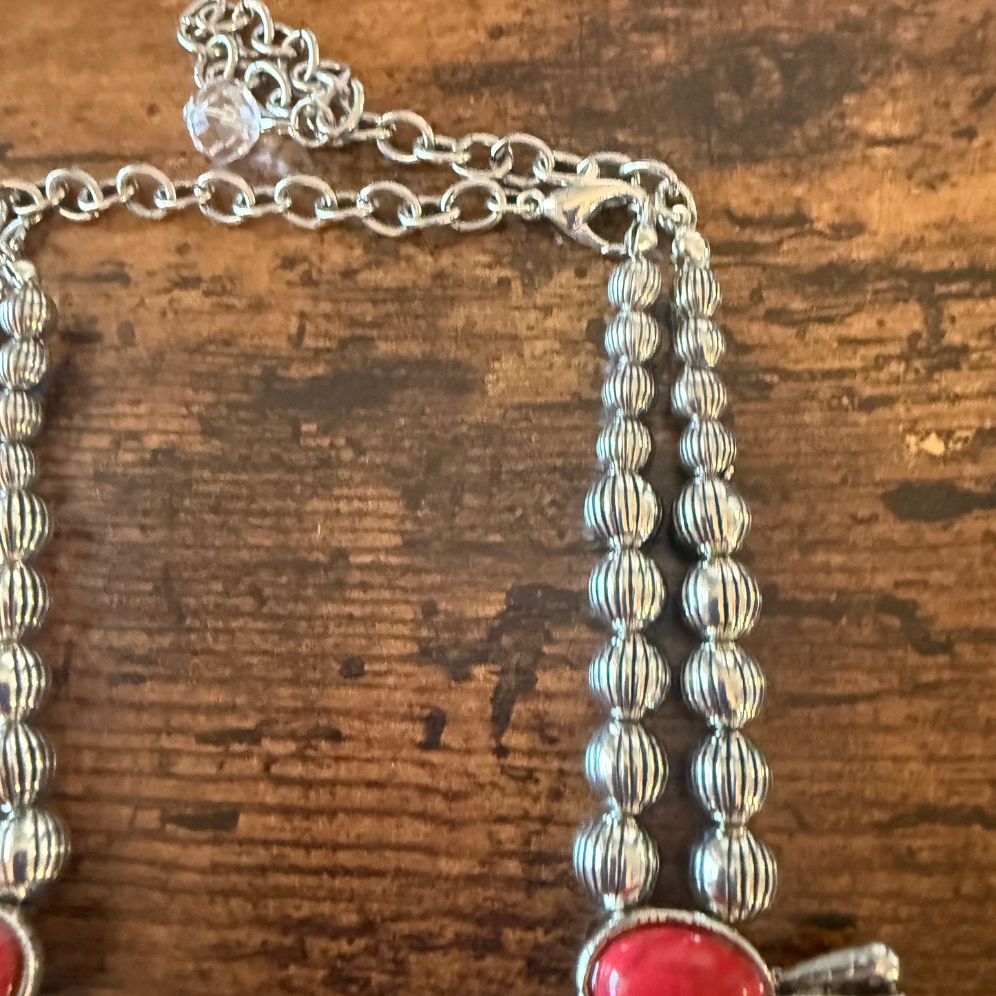 Red stone squash blossom western necklace with faux silver pearl beads and intricate silver detailing.