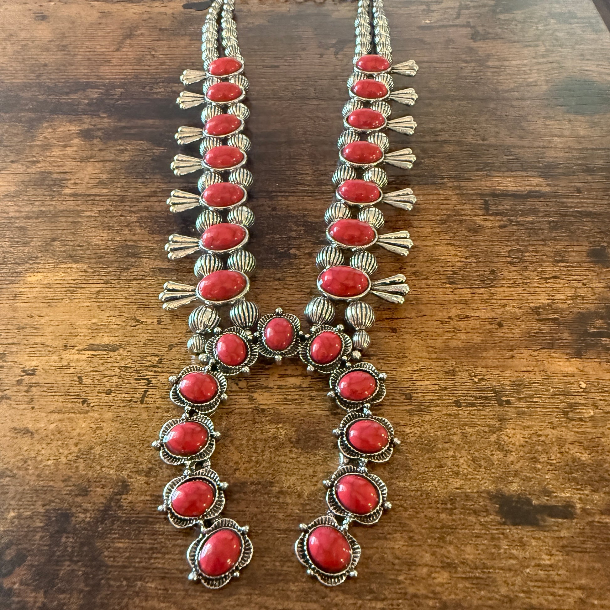 Red stone squash-blossom Western necklace with faux-silver pearl beads and intricate silver detailing.