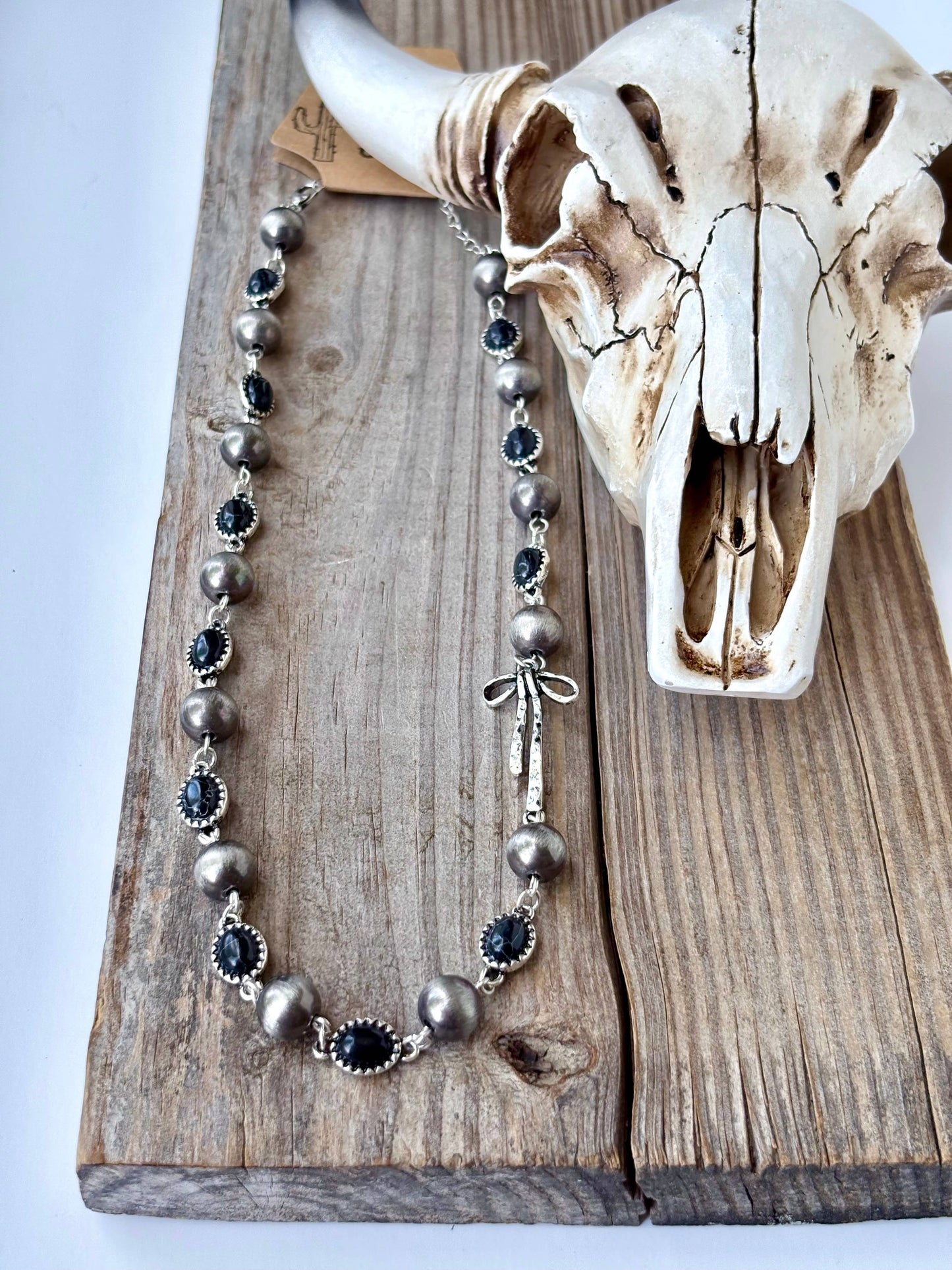 Western Style Navajo Pearl Stone Coquette Bow Necklace in Black and Brushed Silver